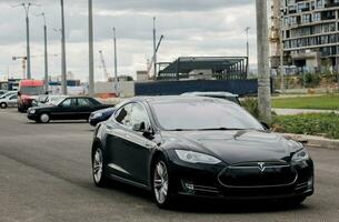 Minsk, Belarus, August 2023 - Tesla parked on the road photo
