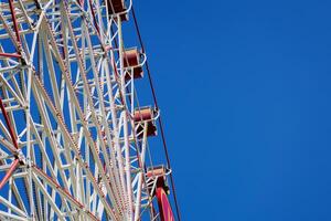 Ferris wheel on blue sky photo