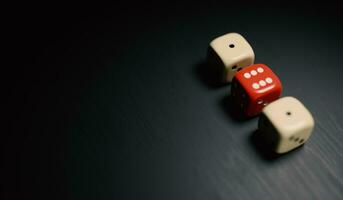 Three stacked dice on a black background, red dice highlighted, representing strength and balance and stability, 3d rendering image photo