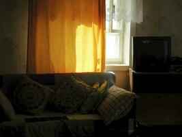 cottage comfort with sofa, window and TV photo