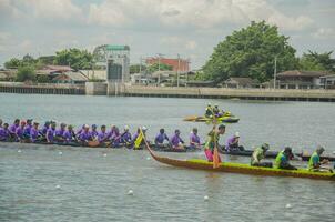 Nonthaburi, Thailand - September 09, 2023 Long boat race. Thai tradition. Nonthaburi Pier photo