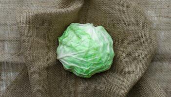 fresh cabbage on a brown fabric background photo