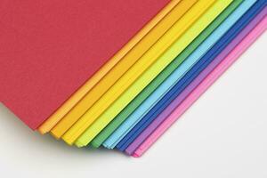 Stacked Colorful Construction Paper on a White Background photo