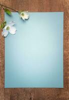Barn wood with blue paper and dogwood flower photo