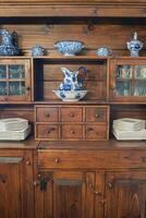 Country Cupboard with Blue and White Dinnerware photo