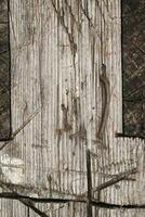 Old Sawhorse with Rusty Nail and Cut Marks Background photo