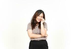 An Asian woman is showing the Korean love sign with a white background, smiling brightly photo