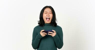 Holding Smartphone and Playing Games on Smartphone Of Beautiful Asian Woman Isolated On White Background photo