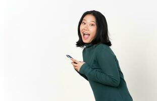 Holding Smartphone and happy smiling looking camera Of Beautiful Asian Woman Isolated On White Background photo