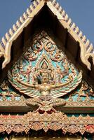 Bas-relief sculpture in the shape of Garuda is a Thai art, an animal in Thai literature, a bird's-eye view, a delicate art created by Thai artists in religious posts. photo