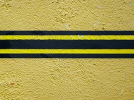 yellow stripes on the concrete floor photo