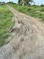 broken asphalt road with cracks, damaged asphalt road. photo