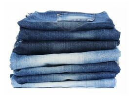 stack of jeans on white background photo