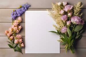 Blank greeting card mockup on wooden background with garden flowers. Summer flat lay composition. Top view with copy space. AI generated. photo