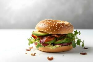 Fresh bagel with bacon, avocado, tomatoes and green salad on white table, light background. Copy space. AI generated. photo