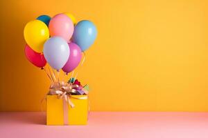 Colorful balloons bunch tied with a gift box on a yellow wall background with copy space. Birthday, wedding, party or celebration concept. Generated AI. photo