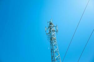 Antenna telecommunications and cable on moon and clear sky background,Beautiful gradient sky and clouds with sunrise,Concept of communication and data transmission,future 5G wireless,view from below. photo