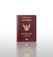Closeup of Thailand passport isolated on white background with reflection, clipping path included. photo