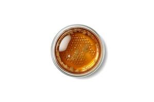 Top view of open jar of honey isolated on white background photo