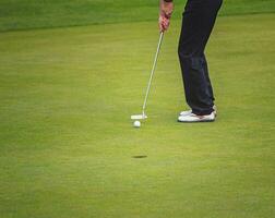 Golf player on the green photo