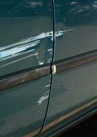 Scratched door paint on a car photo