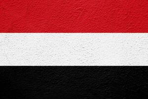 Flag of Republic of Yemen on a textured background. Concept collage. photo