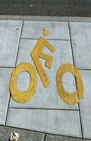 Bicycle sign path on the pavement photo