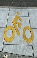 Bicycle sign path on the pavement photo