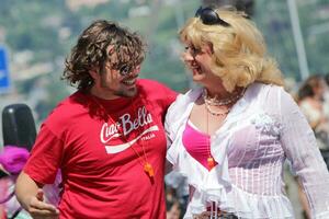 Man and travesti hugging at the Gay Pride 2011, Geneva, Switzerland photo