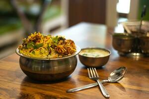 Dum chicken biriyani, close up image of Kerala-Thalassery biriyani which is mixed with masala photo