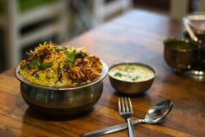 Dum chicken biriyani, close up image of Kerala-Thalassery biriyani which is mixed with masala photo