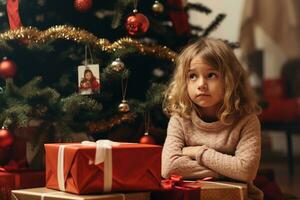Serious sad little girl is sitting in front of a Christmas tree AI Generative photo