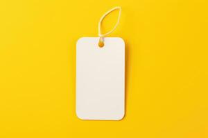 A mock-up of a white empty tag with a rope on a yellow background. AI generated photo