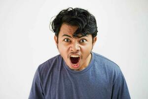 Handsome asian young man angry man screaming , shouting out loud isolated on white background photo