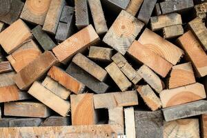 The folded sawn wood lies in the woodpile photo