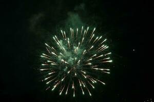 a large firework in the night sky photo