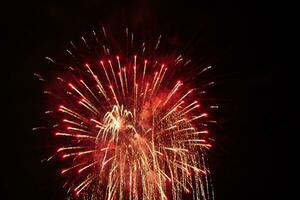 a large firework in the night sky photo