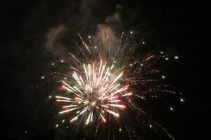 a large firework in the night sky photo