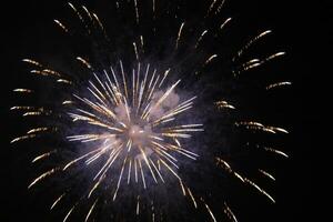 a large firework in the night sky photo