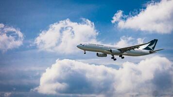 Bangkok, Thailand - August 26, 2023 Cathay pacific airlines prepare for Landing at Suvarnabhumi Airport, Thailand photo