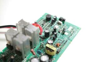 Power Supply modern printed-circuit board with electronic components with transistor. PCB detail photo