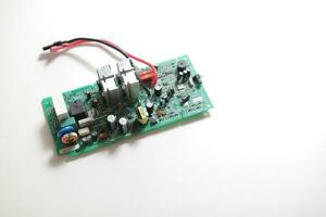 Power Supply modern printed-circuit board with electronic components with transistor. Electrical engineering. photo