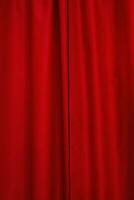 Red cloth. The curtain hangs a vertical photo. Red background. photo