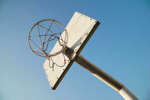Low angle of white basketball ring hoop in the morning, for wallpaper pro photo
