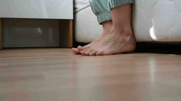 getting up in the morning. low section view of female feet standing on floor after waking up video