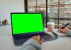 Laptop green screen, background green photo