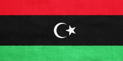 Flag of State of Libya on a textured background. Concept collage. photo