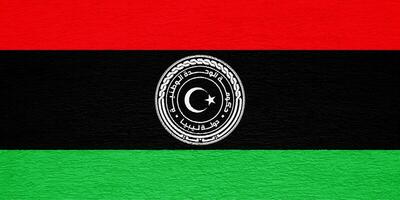Flag and coat of arms of State of Libya on a textured background. Concept collage. photo