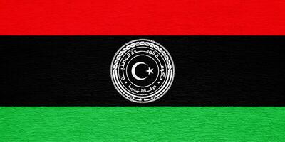 Flag and coat of arms of State of Libya on a textured background. Concept collage. photo