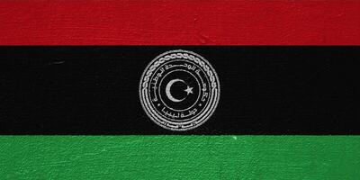 Flag and coat of arms of State of Libya on a textured background. Concept collage. photo